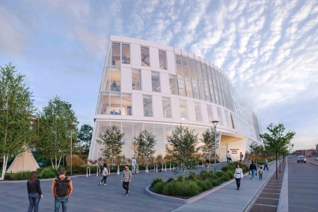 Architectural rendering of the new Saskatoon Public Library building viewed from the street. The curved multi-storey structure features expansive glass walls, landscaped public space, and pedestrians walking along the surrounding pathways beneath a dramatic sky.